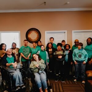 Group of people wearing green shirts together.